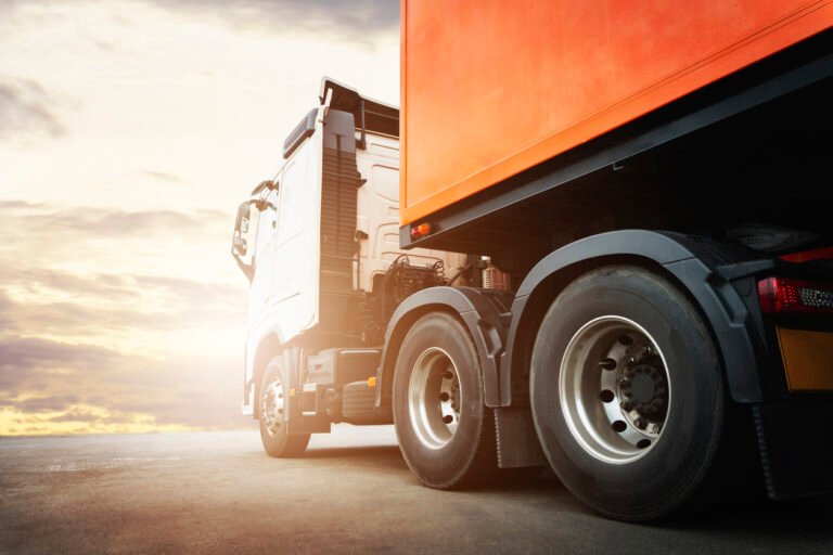 Biometanas: Semi Trailer Truck A Parking at Sunset Sky. Industry Road Freight Truck. Logistic and Cargo Transport Concept.. Biometano stotelių žemėlapis Lietuvoje